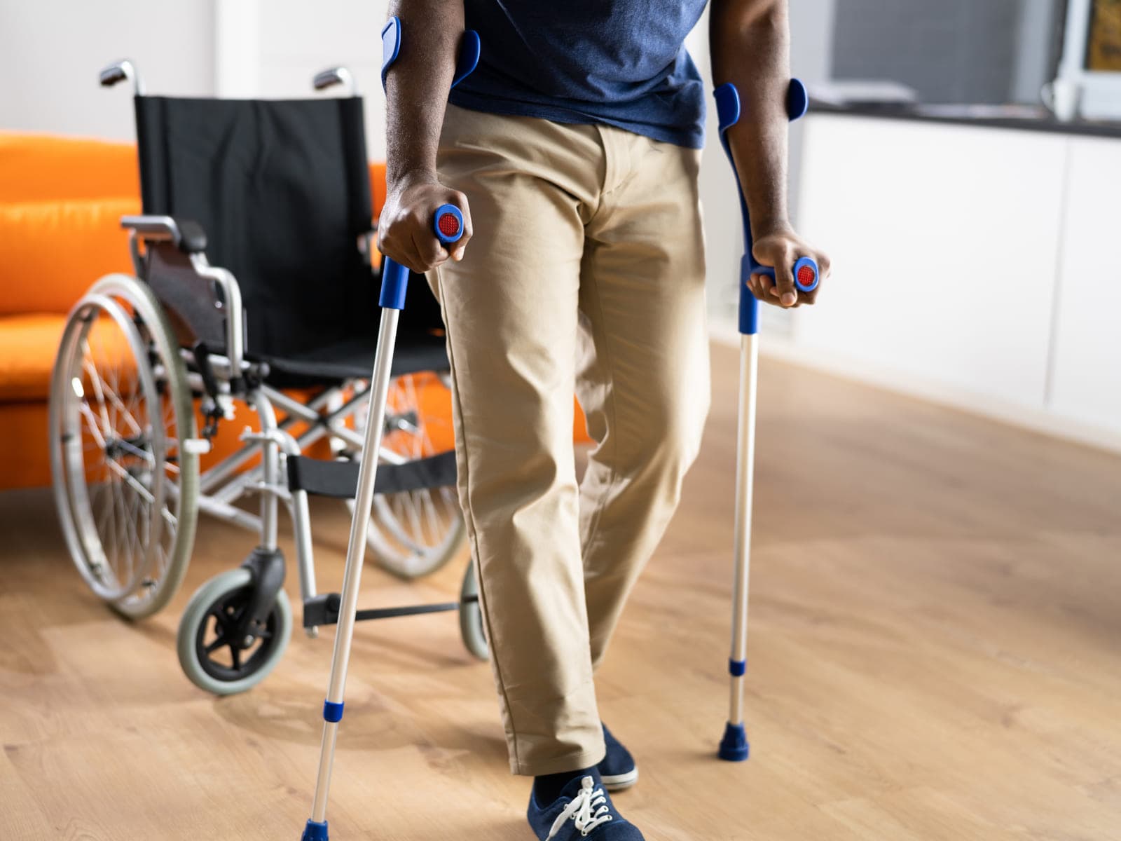 Crutches and a wheelchair set up in a Calgary living room