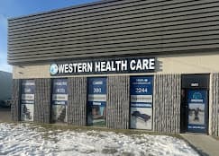 Western Health Care window displays showing stairlift, ramp, hospital bed